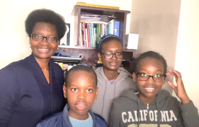 Rev. Josephine Mutuota and her children pastor in the Nairobi North Presbytery, sing hymns.