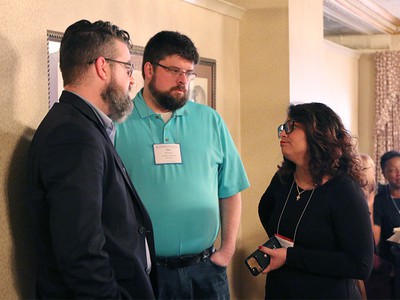 The Reverend Chris McCurdy (left) and his brother, the Reverend Dan McCurdy (right), converse with Ruling Elder Vilmarie Cintrón-Olivieri, Co-Moderator of the 223rd General Assembly (2018) during the recent Moderators’ Conference in Louisville. Photo by Rick Jones.