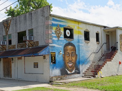 Mural of Ahmaud Arbery painted on the future site of the African American Cultural Center in Brunswick, Georgia.