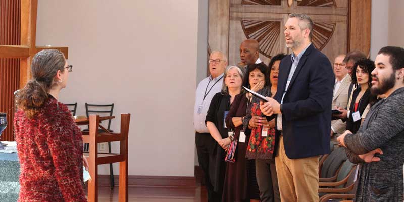 Robin Pugh, a member of the Committee on the Office of the General Assembly, helps lead worship Wednesday at the Presbyterian Center. Photo by Rick Jones.