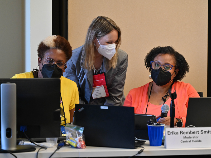 Vice-Moderator Angela Madison, Committee Assistant Rachel Yates, and Moderator Erika Rembert Smith confer during a meeting of the Addressing Violence in the USA Committee on June 23, 2022, at the 225th General Assembly of the Presbyterian Church (U.S.A.) in Louisville, Kentucky. (Photo by Rich Copley)