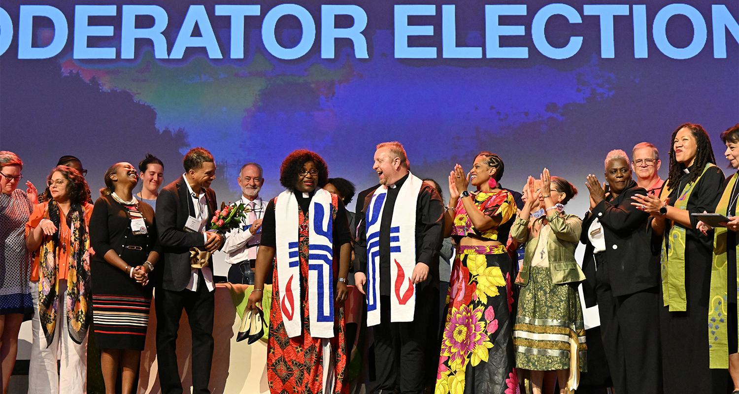 The Co-Moderators of the 226th General Assembly celebrate their election with family and co-moderators from previous assemblies on Sunday night. Photo by Rich Copley. 