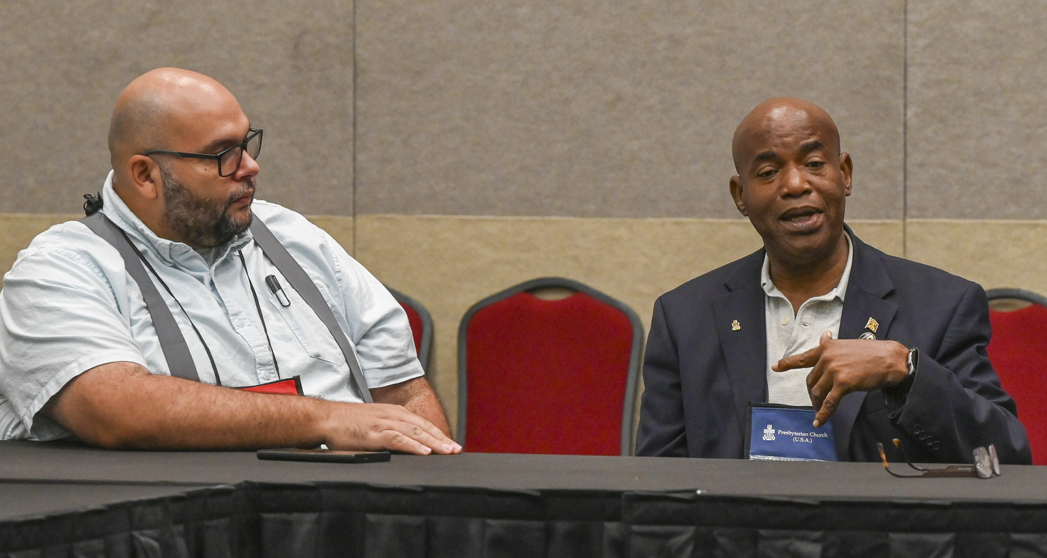 Rev. Dr. R. Osbert James, Pastor of the Presbyterian Church in Greneda since 2002, speaks about the impact of Hurrican Beryl on his homeland with Rev. Edwin Gonzales-Casillo, Director of Presbyterian Disaster Assistance. Photo by Rich Copley