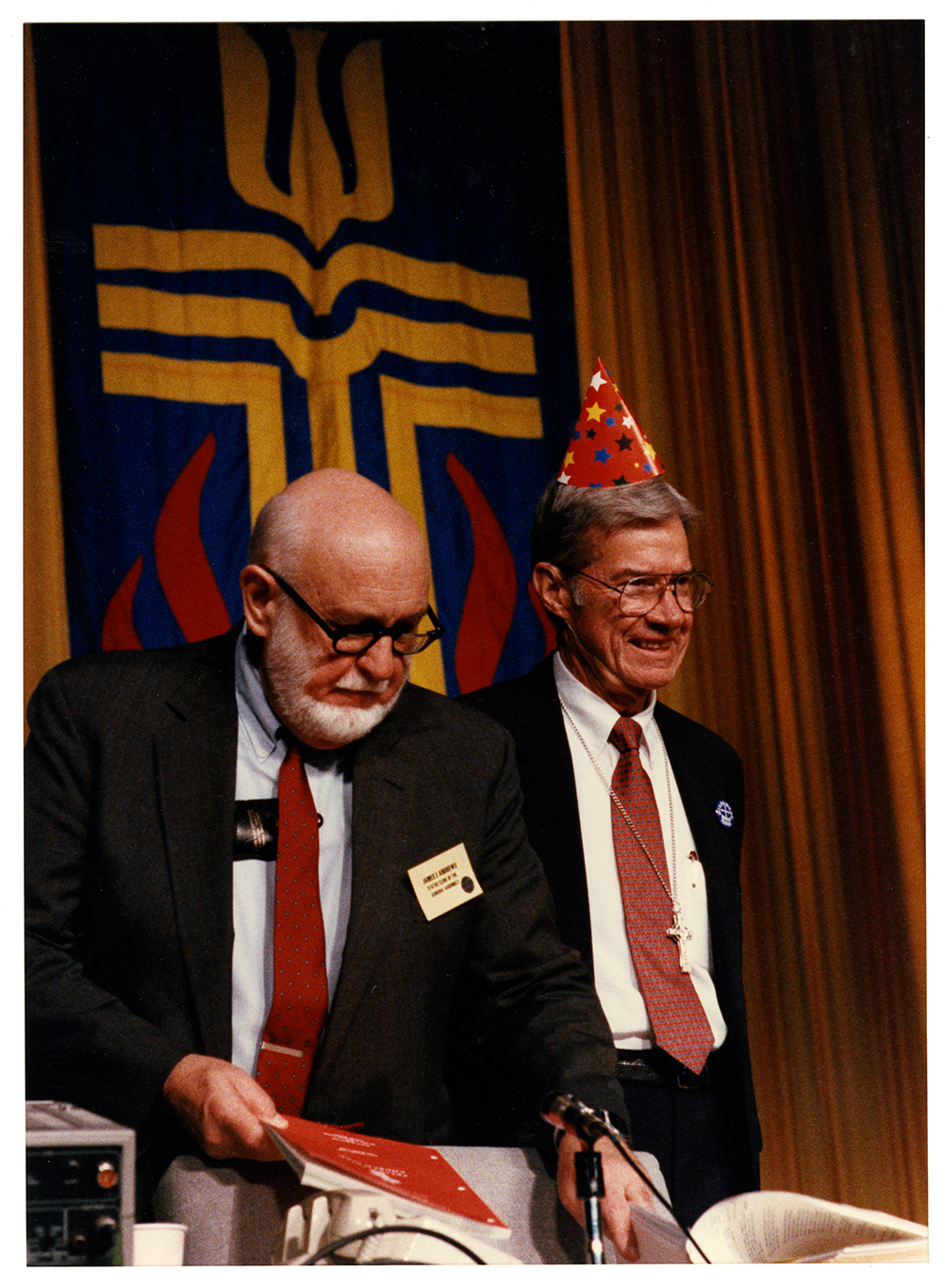 Moderator Price Gwynn is all smiles after the mortgage papers burning.