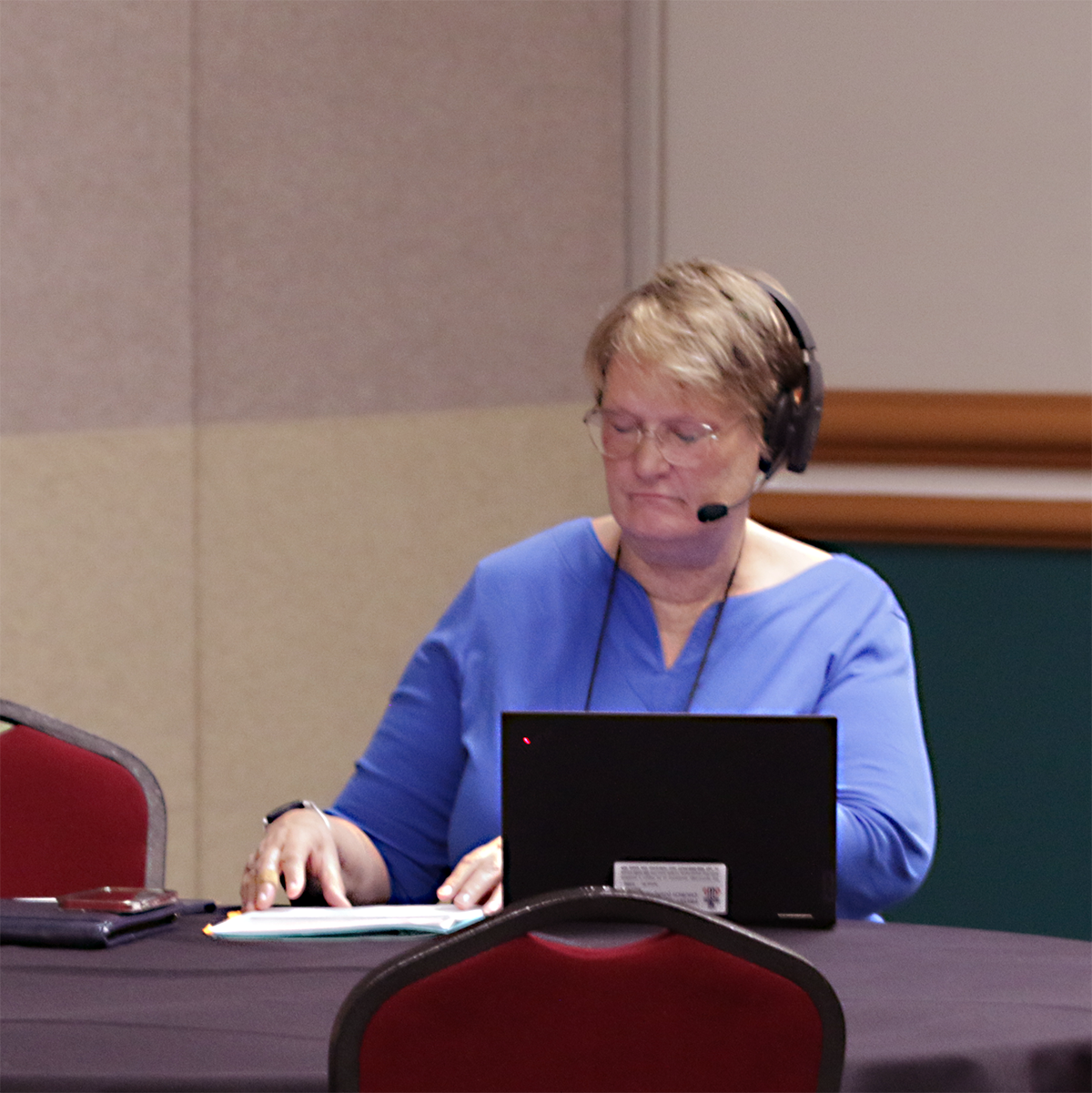 The Rev. Bronwen Boswell prepares for discussion with committees on June 27, 2024 during the 226th General Assembly in Salt Lake City. Photo by Randy Hobson.