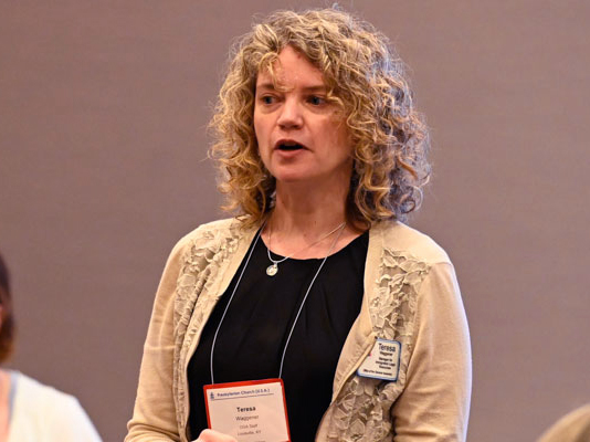 Teresa Waggener, an attorney with the Office of Immigration Issues, speaks to about 40 people attending a Big Tent workshop on asylum and immigration networking. (Photo by Rich Copley)