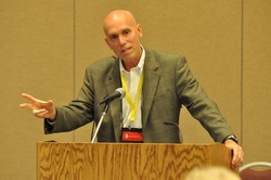 Ray Jones speaks at a podium