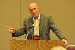 Ray Jones speaks at a podium.