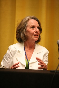 Photo of Rev.Karen Dimon at a podium