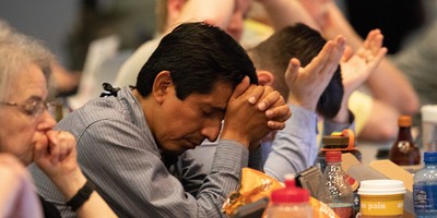 Comissioners pray for Gaza during the the [12] Middle East Issues Committee report at the 223rd General Assembly.