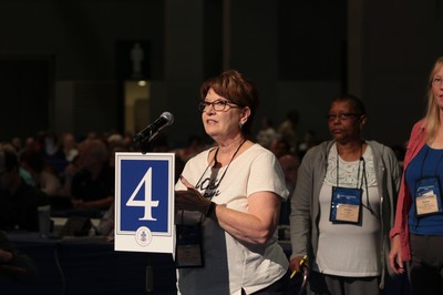 Debbie Cenko, commissioner from New Covenant Presbytery, speaks during Saturday morning's plenary.