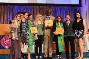 YAADs, Co-Moderators Cindy Kohlmann and Vilmarie Cintrón-Olivieri and Stated Clerk J. Herbert Nelson, II receive YAAD check