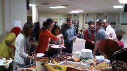 Children of Abraham members gather to build a sukkah and celebrate at Temple Beth El