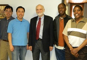 Deacon Bertin (second from right) with Walter Brueggemann and others at Church of All Nations.