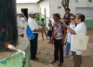 SDOP Task Force Member Cecilia Moran (far right) inspects a water project in the Dominican Republic. The Batey Relief Alliance and the Movement of Haitian-Dominican Women joined together to construct clean water systems in 11 bateys throughout the central and eastern regions. The systems provide clean water to approximately 8,700 people.