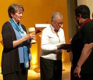 The Rev. Chineta Goodjoin, pastor of New Hope Presbyterian Church in Orange, Calif., receives communion at Ash Wednesday services.