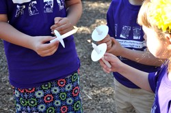 Children and adults light candles at the Easter Vigil. 