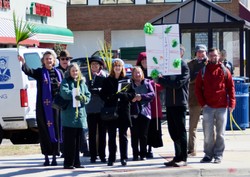 Arlington Presbyterian Church, led by pastor Shannon Core (far left), taking worship into the community on Palm Sunday morning.