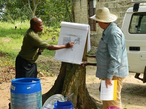 Omba Ngandu, Rivers of the World-Congo country director, and Charles Johnson discuss the use, maintenance and installation of a gravity-fed drip irrigation system with a women’s farming group sponsored by PRODEK.