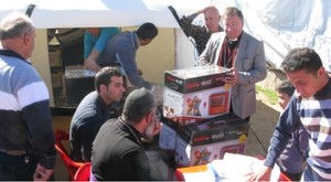 Pastor H and elders from Kirkuk working with the Orthodox Church to distribute heaters to displaced families in Northern Iraq.