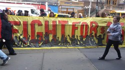 Fast-food workers protest in both Los Angeles and New York City to raise wages to $15 an hour.