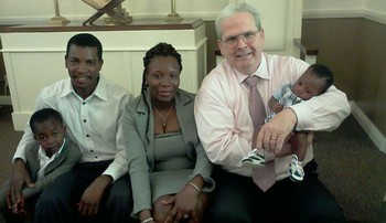 Bill Jenkins with a Haitian refugee family at Christ Ministry Center in San Diego.