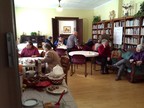 People in the church library having breakfast.