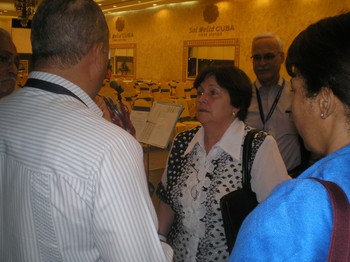 Caridad Diego Vello speaks with delegates after she addressed the 6th Assembly of the Latin American Council of Churches.