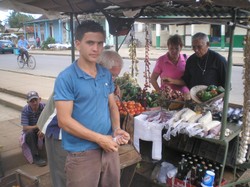 A son and his father at their roadside farm market