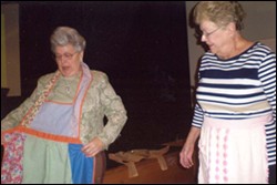 Volunteers at Casa de Vida don their aprons to serve lunch.