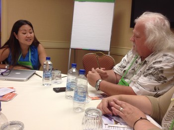 Christine Hong talks with Bill Bess, a workshop participant from Havana, Fla. 