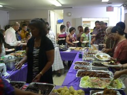 People in line for dinner in a church.