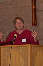 A man speaking from a lectern.