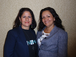 Two women standing together for a photo.