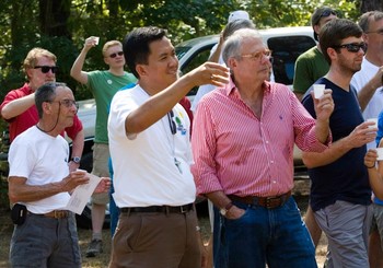 Moderator Neal Presa and others participate in Clean Water U's water celebration.