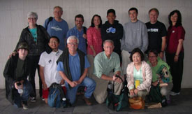 A group of people standing together for a photo.