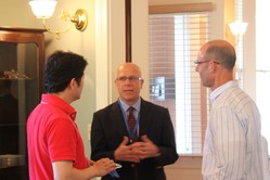 Jim McDonald visits with two SFTS students. 