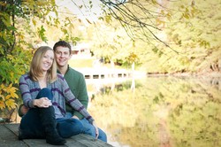 A man and a woman by a lake.