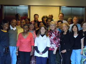 A group of people standing together for a photo.