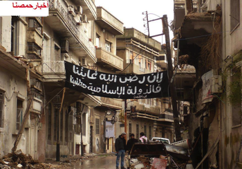 Photos in 2012 of the same square of former Palm Sunday 2010 at the Christian Quarter in Homs old city. 