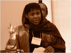 A photo of a woman leading worship.