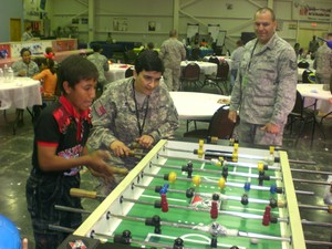 The Rev. Lucy Der-Garabedian plays with an Iraqi child.