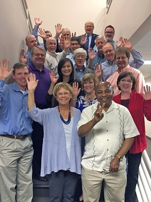 Grace Presbytery Council celebrating support of World Mission. Executive Presbyter, Jan DeVries, is pictured in purple sweater on bottom step.