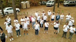 Clean Water U participants prepare to taste clean water treated by their class.