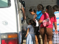 “They did unspeakable things to us,” says this woman (holding her child), who asked not to be identified. She and a friend were kidnapped as they made their way to the Mexico-U.S. border. 