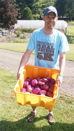 Jason Taylor with pepper grown on the Stony Point Center farm.