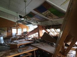 Interior of the damaged dining hall at John Knox Ranch.