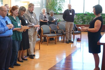 PMA board member Marci Glass delivers the blessing at the 2016 Small Church Residency program commissioning service for pastoral residents in Louisville.