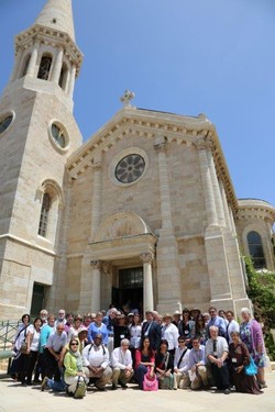 Mosaic of Peace participants in front of Evangelical Lutheran Christmas Church.