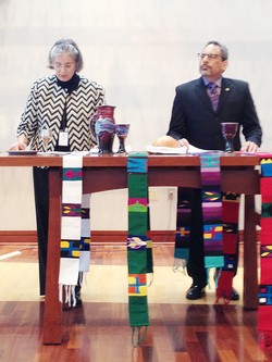 Rosemary Mitchell and Tony De La Rosa prepare to celebrate communion during the 'Service of Gratitude, Grief, and Grace,' honoring departing PMA colleagues. 